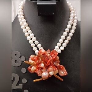 Elegant fresh water Pearl necklace and a floral shell cluster